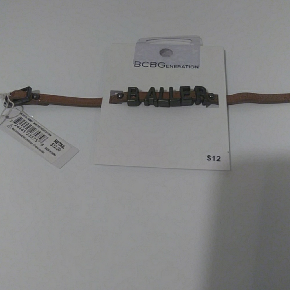 Boys Florescent orange BALLER bracelet.